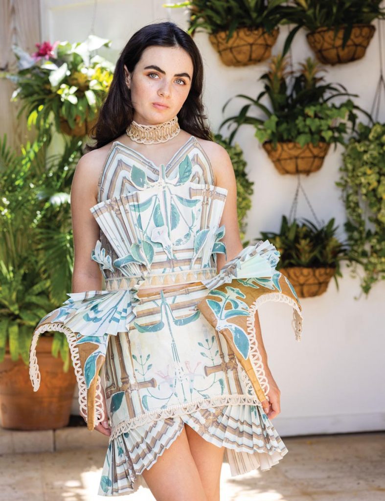 Jolie Copin, a senior at the Dreyfoos School of the Arts, models her design made from Leta Austin Foster wallpaper in the Honeysuckle Treillage print
